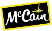 McCain logo featuring bold black background, playful font, and vibrant yellow spark for frozen food.